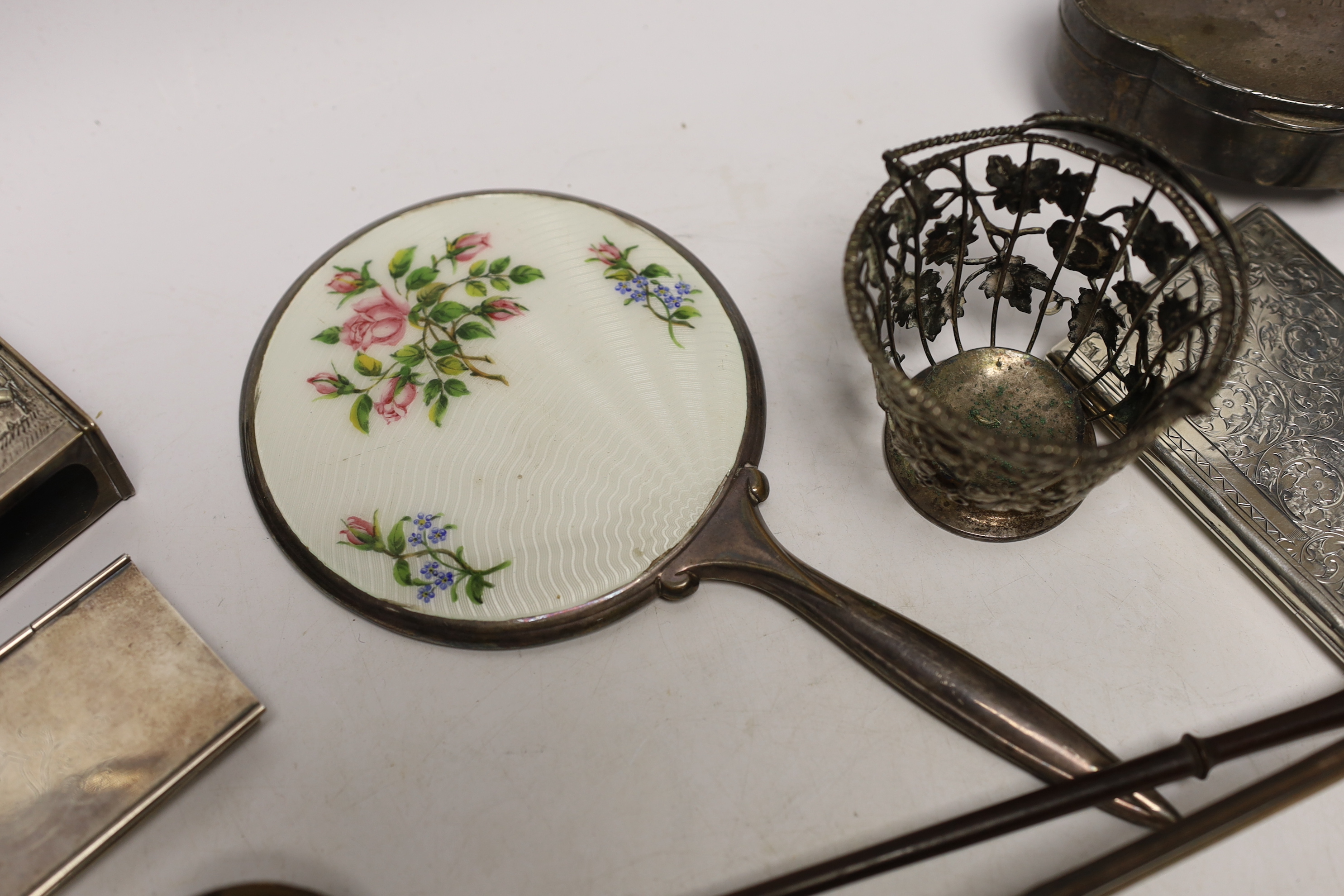 A group of assorted silver and white metal items including a George V trinket box, cigarette case, sterling stamp box, Dutch matchbox holder, George V sugar basket by William Comyns (no liner), two toddy ladles and two o